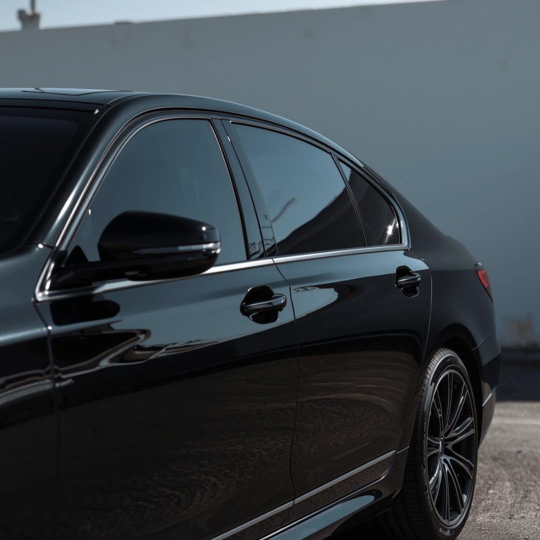 Dark sedan with tinted side windows